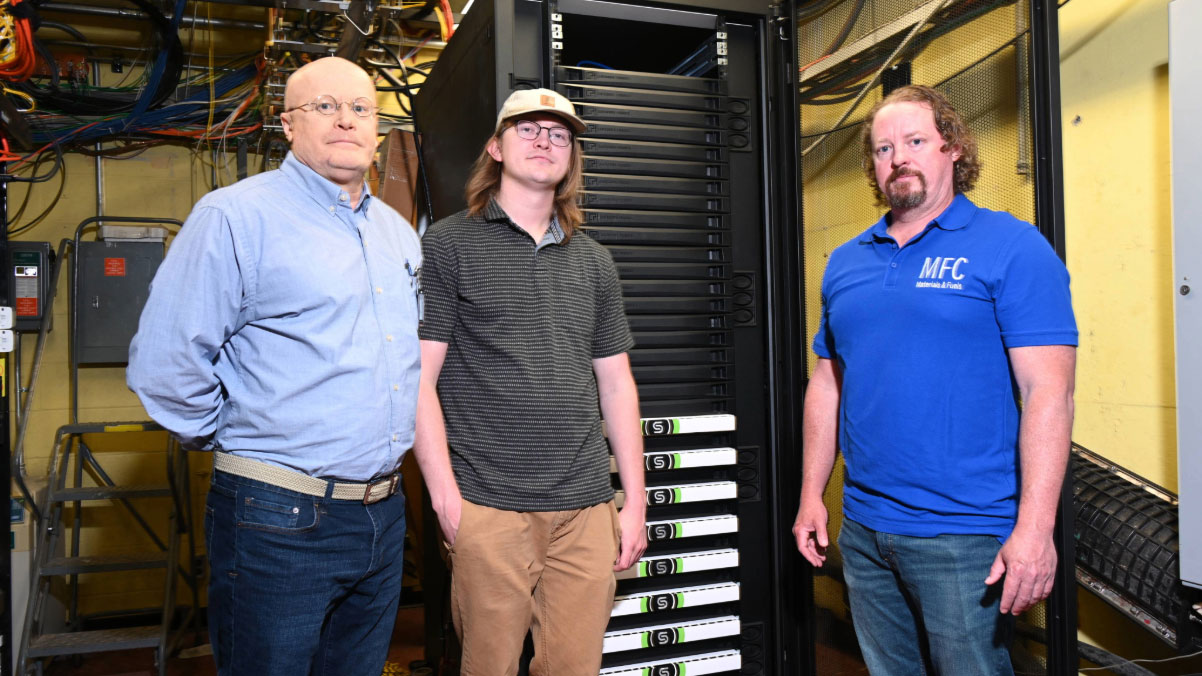 3 men standing in mechanical room